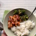 Second cook: teriyaki chicken in a bowl, fork in hand